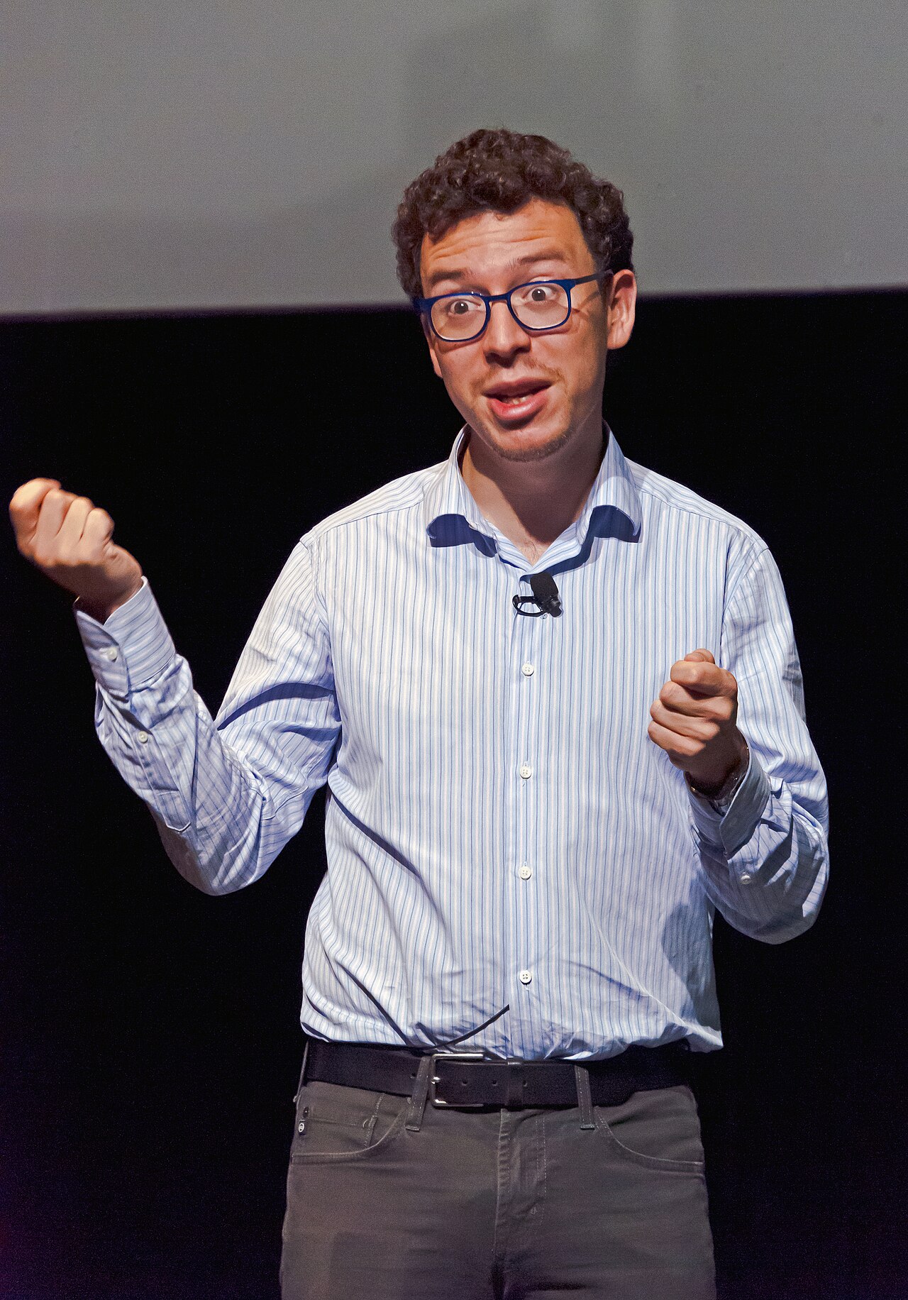 Luis von Ahn speaks at a lectern during Wikimania 2015.